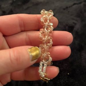 Stretch handmade bracelet with light pink and white sparkly beads with clasp.